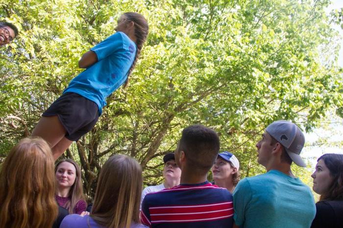 A group of students watching a challenge.